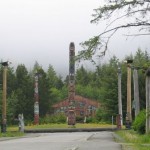 Totem poles line the Saxman Native Village entrance