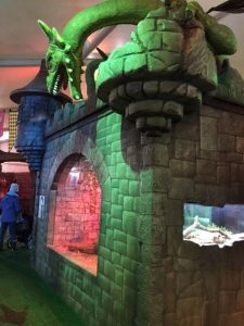 A mythological creature has landed on a castle harboring a live dragon from today's world at Dinos & Dragons at Brookfield Zoo. Photo by Jodie Jacobs