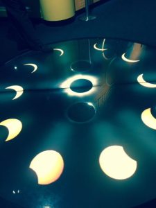 The different phases of a solar eclipse are on a floor at the Adler Planetarium in'Chasing Eclipses.' Jodies Jacobs photo