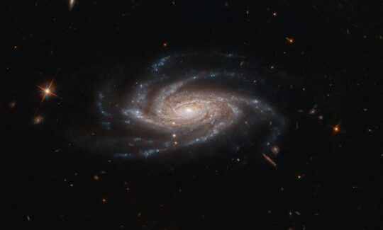 The spiral galaxy NGC 2008 sits centre stage, its ghostly spiral arms spreading out towards us, in this image captured by the NASA/ESA Hubble Space Telescope. (NASA photo)